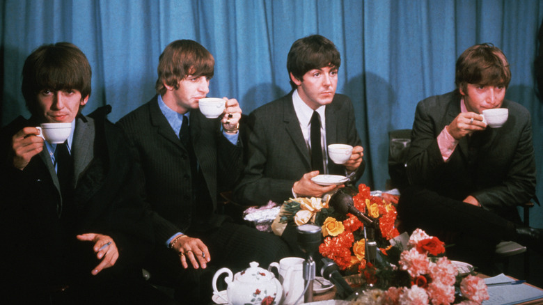 The Beatles drinking tea