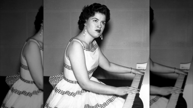 Patsy Cline playing piano.