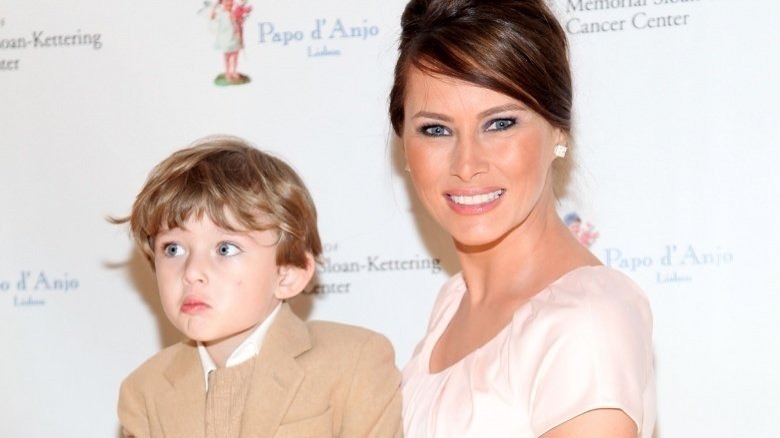 Young Barron Trump and Melania Trump posing