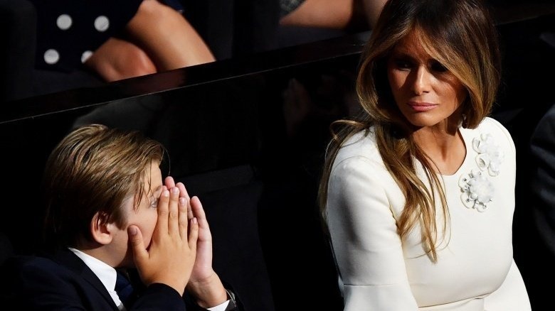 Barron Trump and Melania Trump at event