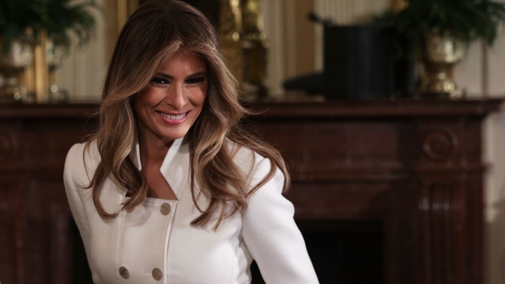 Melania Trump wearing a white pea coat
