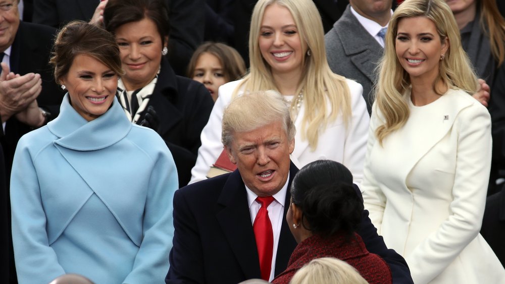 Melania, Tiffany, Ivanka, and Donald Trump smiling