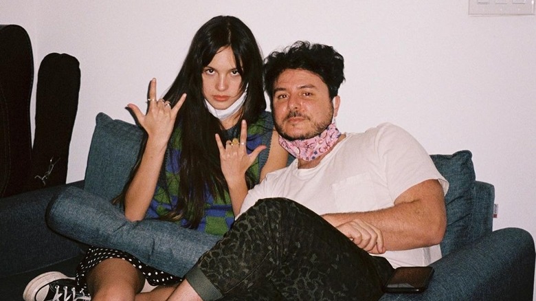 Olivia Rodrigo and Dan Nigro sitting together