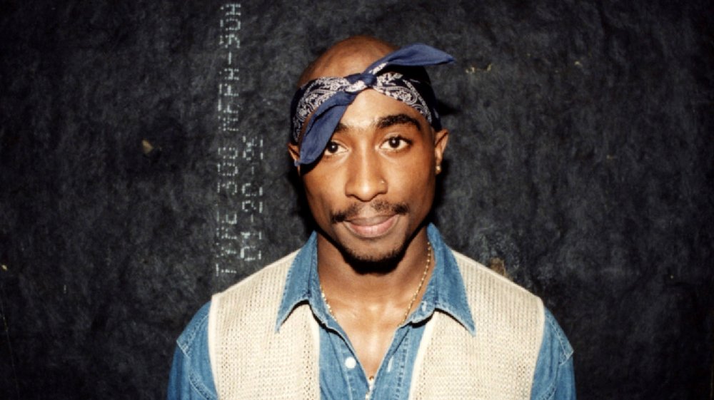 Tupac Shakur wearing denim