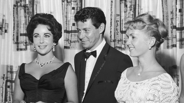 Elizabeth Taylor, Eddie Fisher, and Debbie Reynolds pose in 1958.