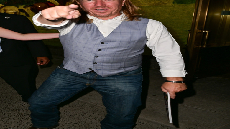 Chip Gaines points playfully at paparazzi.