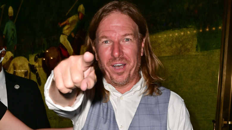 Chip Gaines points playfully at paparazzi.
