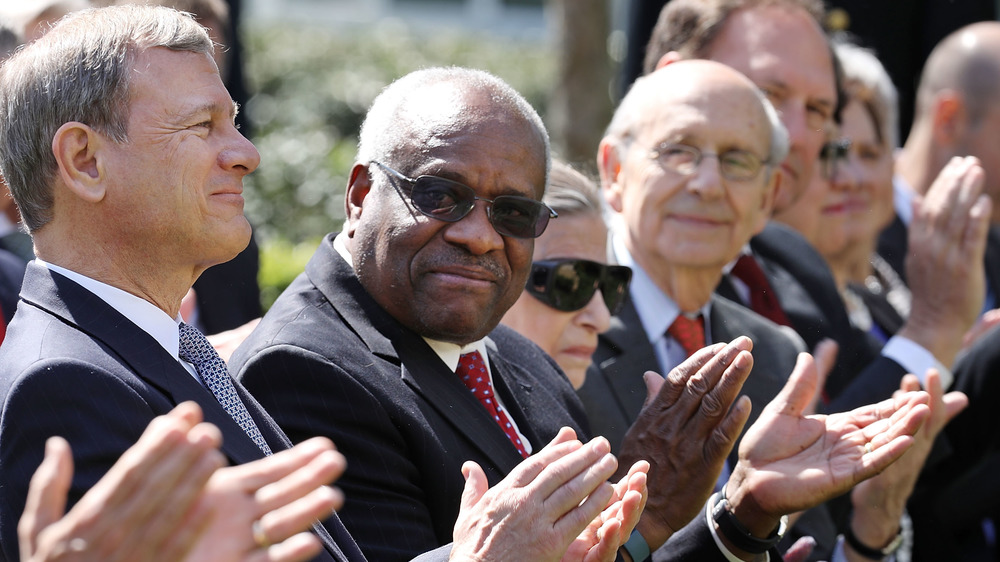 Supreme Court Justices Clarence Thomas, Stephen Breyer and Samuel Alito clapping