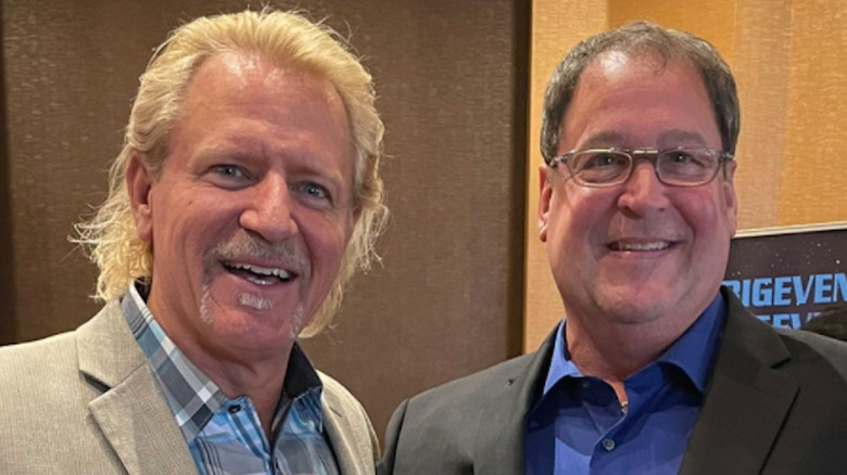 Tony Chimel smiling with Jeff Jarrett