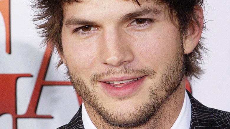 Ashton Kutcher smiles on the red carpet