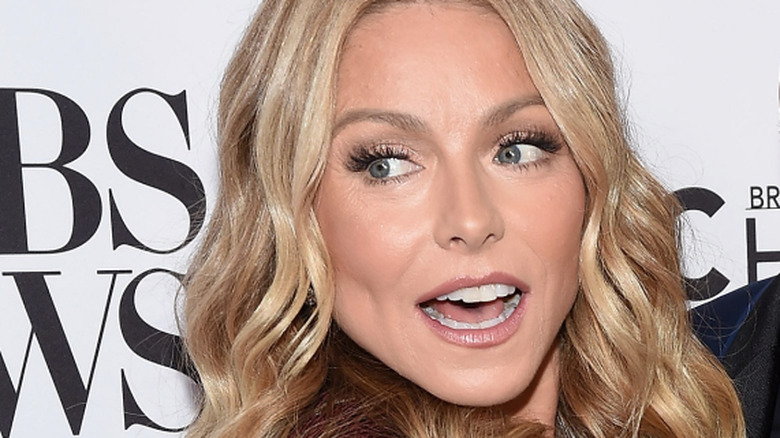 Kelly Ripa and Ryan Seacrest getting cheeky in 2019