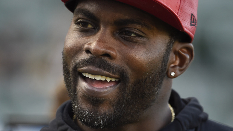 Michael Vick smiles on the football field