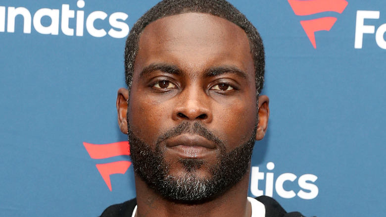 Michael Vick gives a stern look on the red carpet