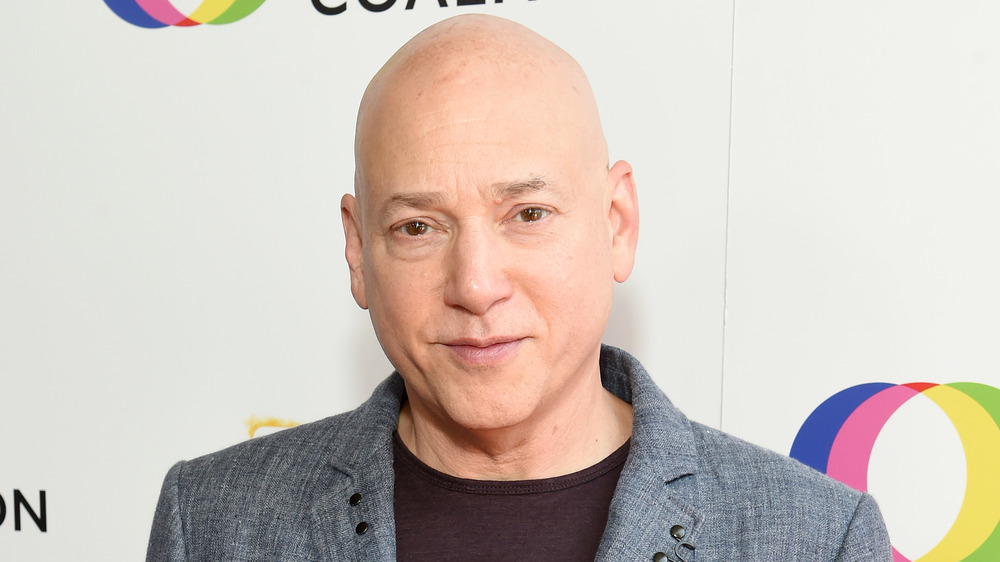 Evan Handler smirking 