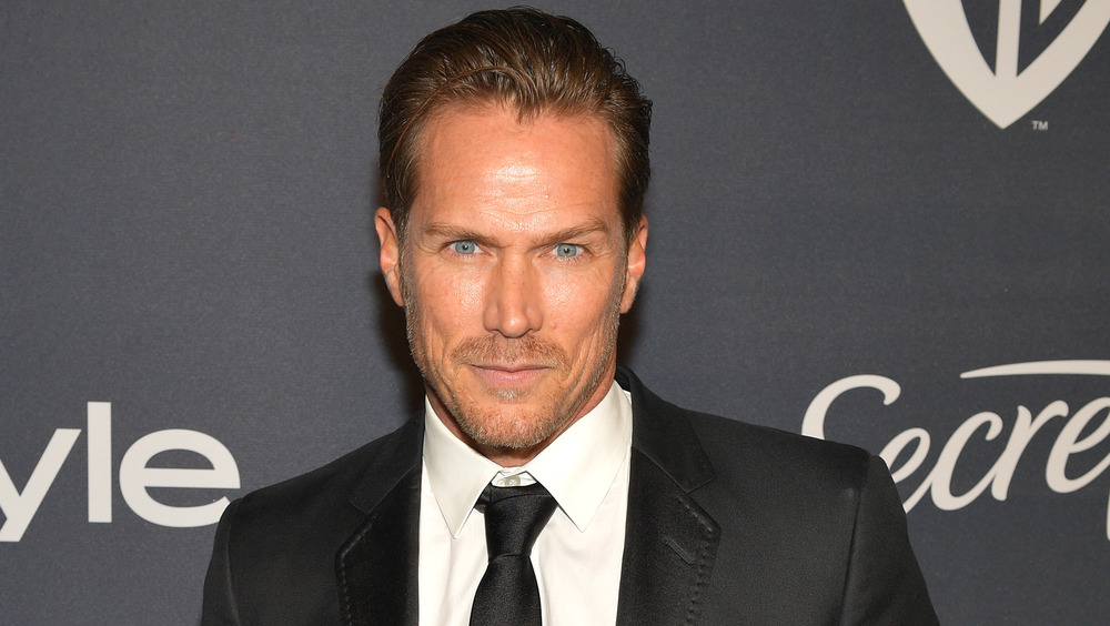 Jason Lewis smirking 