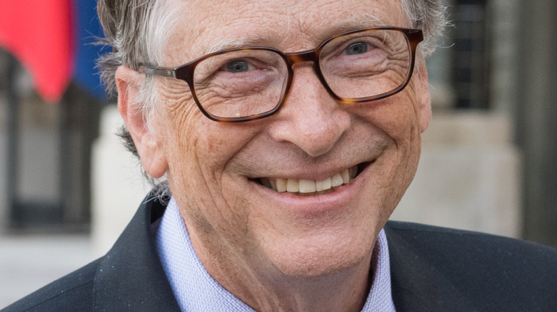 Bill Gates smiling and wearing glasses