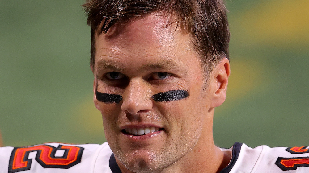 Tom Brady wearing eye black and looking serious