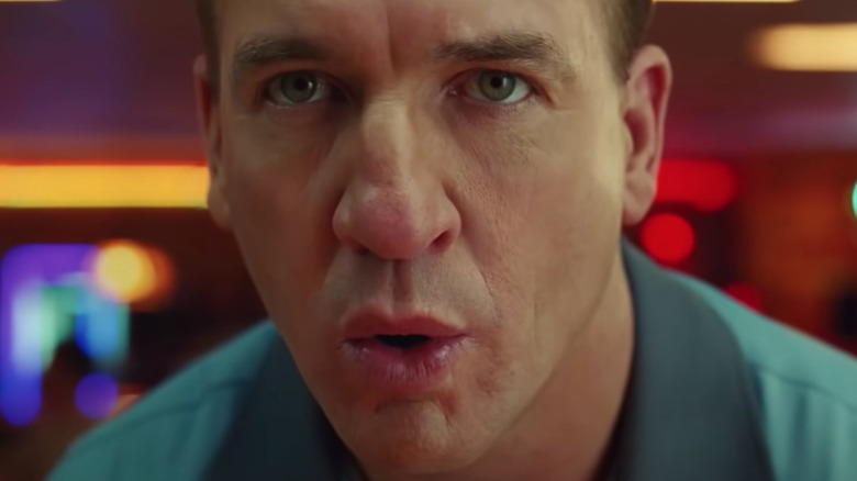 Peyton Manning exhaling with pursed lips to focus