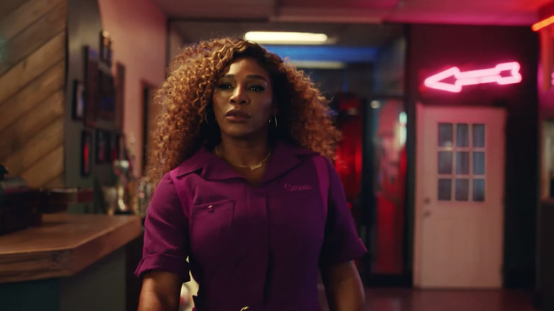 Serena Williams walking with a focused expression