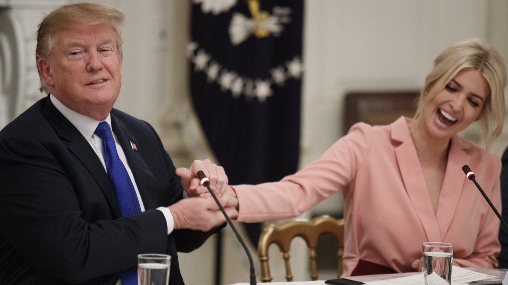 Donald Trump holding Ivanka Trump's hand at a meeting in the State Dining Room at the White House 