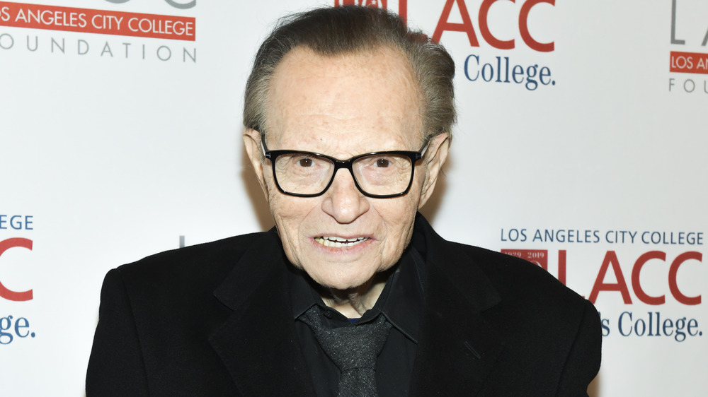 Larry King wearing black on the red carpet