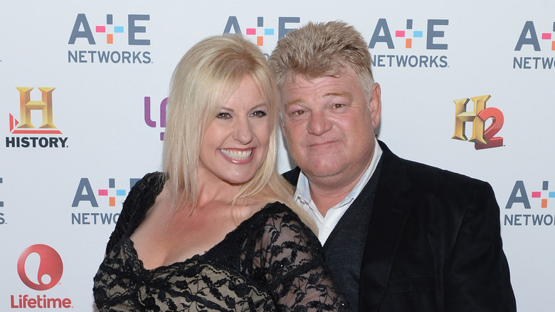 Laura and Dan Dotson smiling on the red carpet