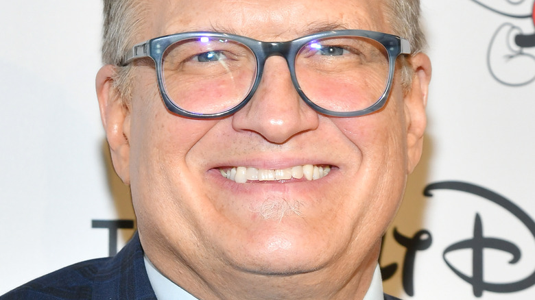 Drew Carey smiling on the red carpet