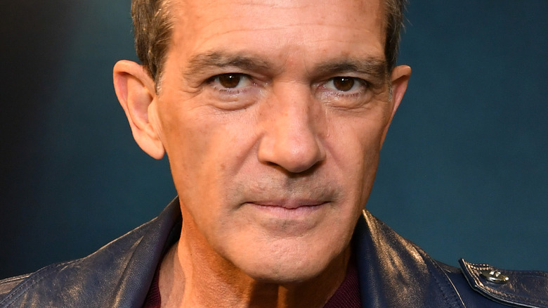 Antonio Banderas poses in a leather jacket.