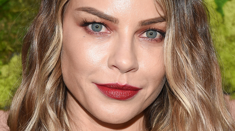 Lauren German poses in red lipstick