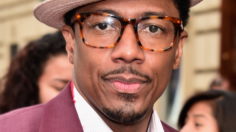 Nick Cannon wearing a fedora hat