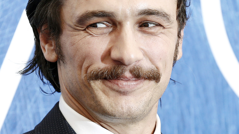 James Franco smirking on the red carpet