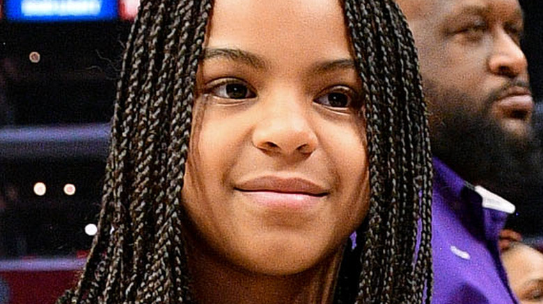 Blue Ivy Carter smiling at a 2020 basketball game