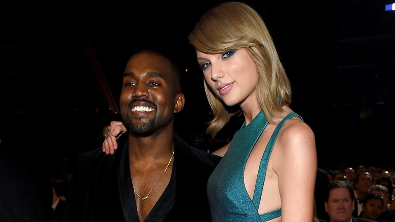 Kanye West and Taylor Swift posing