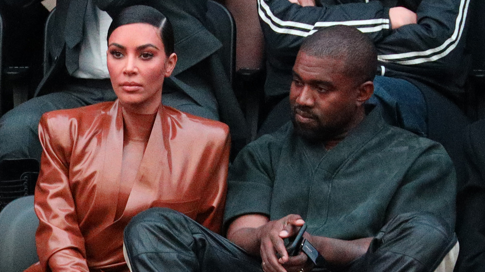 Kim Kardashian and Kanye West at a basketball game