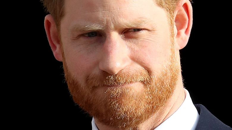 Prince Harry with a neutral expression