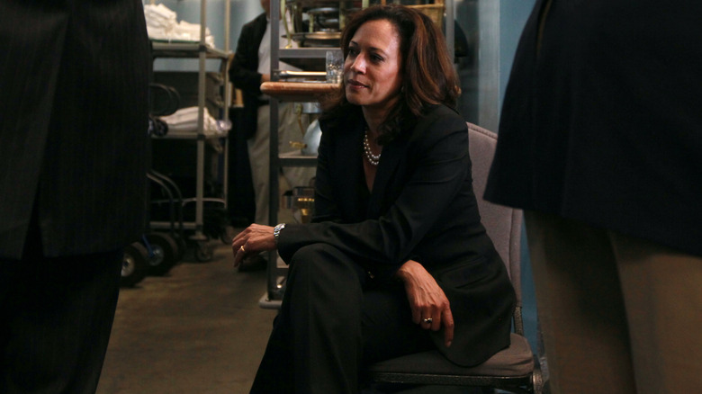 Kamala Harris sitting backstage at a rally in 2010.