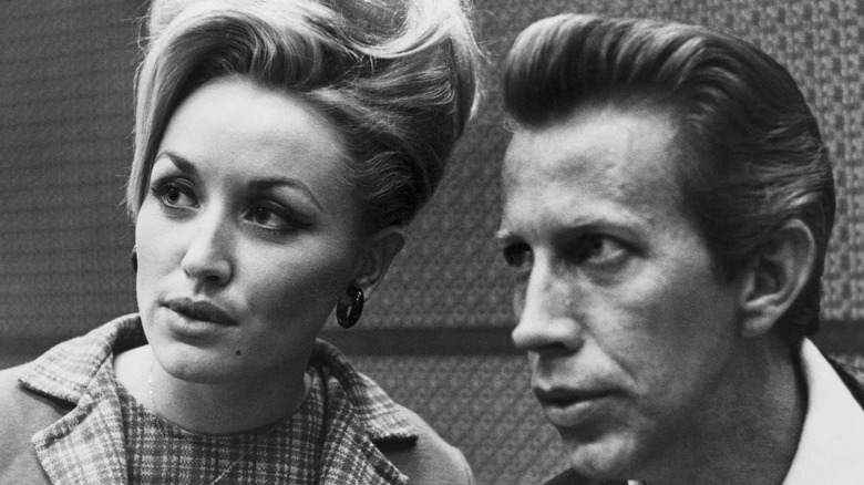 Dolly Parton and Porter Wagoner gaze into the distance.