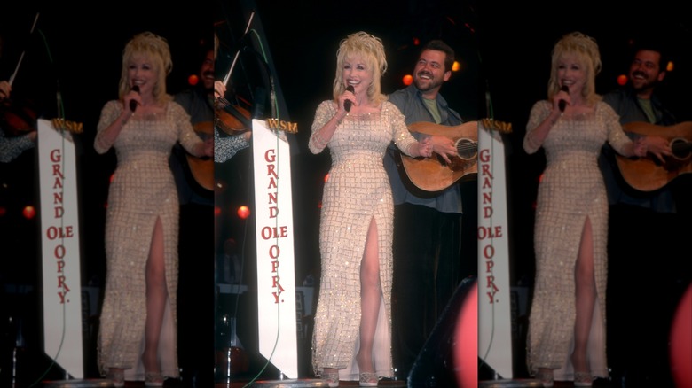 Dolly Parton flaunts her killer legs through a thigh-high slit.