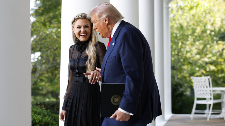 Erika Kirk and President Trump talking while walking at the White House