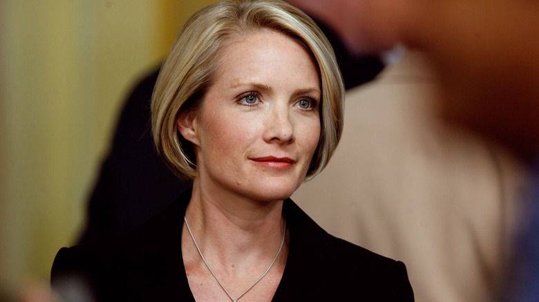 Dana Perino pictured in a black blazer with a sleek bob during her press secretary days