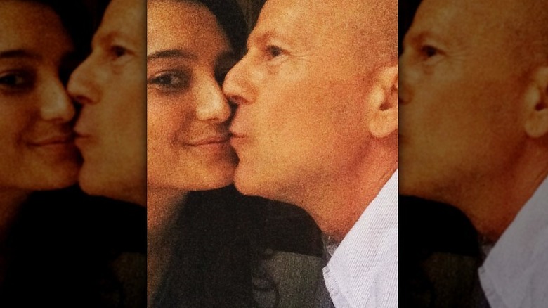 Bruce Willis and Emma Heming Willis kissing
