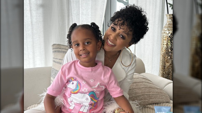 Tia Mowry smiling with daughter Cairo