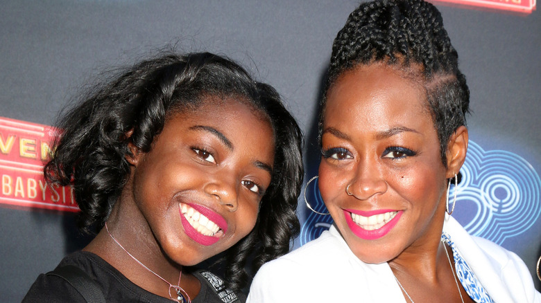 Alijah Kai and Tichina Arnold smile at a 2016 event