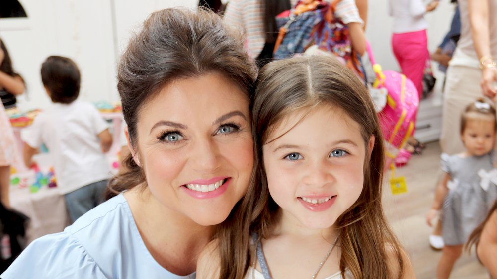 Tiffani Thiessen and daughter Harper pose for a photo during the Num Noms event hosted by Tiffani Thiessen at Au Fudge Los Angeles