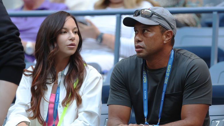 Erica Herman looking at Tiger Woods
