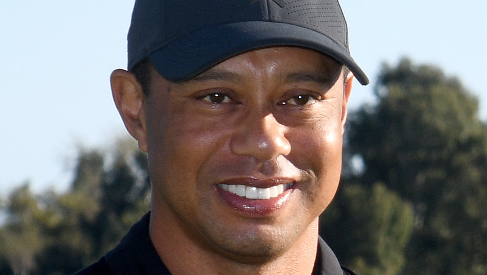 Tiger Woods smiles on the field