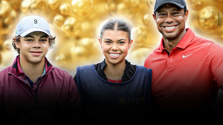 Tiger Woods posing with Charlie and Sam Woods at the 2023 PNC Championship