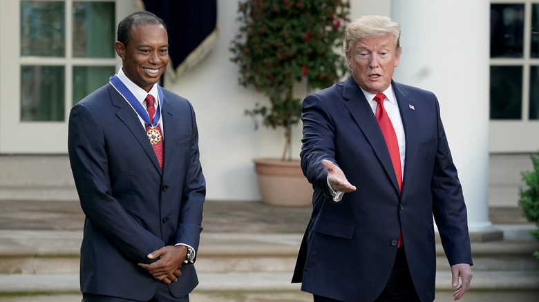 Tiger Woods and Donald Trump outside the White House after Woods was presented with his Medal of Freedom.