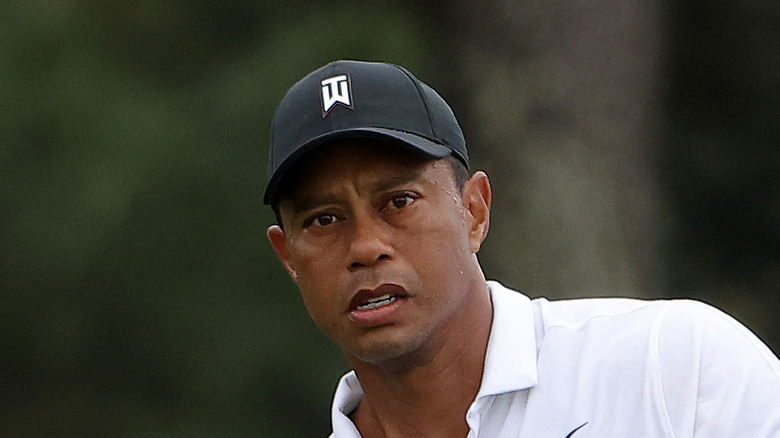 Tiger Woods in a black hat