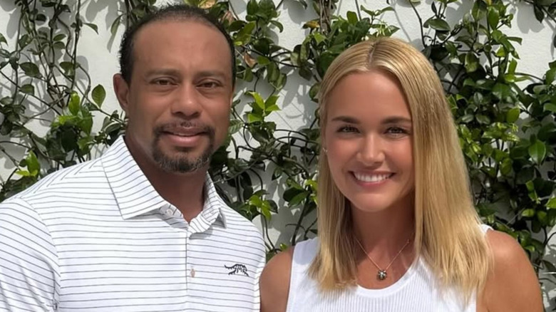 Tiger Woods posing with Vanessa Trump